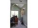Bright office space with a tall window and functional furniture set at 9722 Indian Key Trl # 116, Seminole, FL 33776