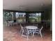 Outdoor patio with tables and chairs at 9722 Indian Key Trl # 116, Seminole, FL 33776