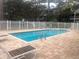 Outdoor community pool with lounge chairs and pool furniture at 9722 Indian Key Trl # 116, Seminole, FL 33776