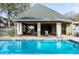 Community pool with lounge area for relaxation and enjoyment at 9722 Indian Key Trl # 116, Seminole, FL 33776