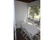 Screened-in porch featuring a white table and chairs at 9722 Indian Key Trl # 116, Seminole, FL 33776