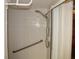 Accessible shower with grab bar and adjustable shower head at 9722 Indian Key Trl # 116, Seminole, FL 33776