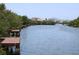 Scenic waterfront view with docks and lush greenery at 9722 Indian Key Trl # 116, Seminole, FL 33776