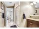 Bathroom featuring a granite vanity, and a glass-enclosed shower at 10513 Carrollview Dr, Tampa, FL 33618