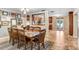 Inviting dining room featuring a wooden table with seating for eight and decorative wall art at 10513 Carrollview Dr, Tampa, FL 33618
