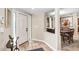Bright entryway with tile floors flowing into the kitchen and dining area at 10513 Carrollview Dr, Tampa, FL 33618