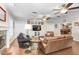 Cozy living room showcasing hardwood floors, comfortable seating, and a decorative fireplace at 10513 Carrollview Dr, Tampa, FL 33618