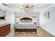 Serene main bedroom with plush carpeting, a ceiling fan, and soothing light blue walls at 10513 Carrollview Dr, Tampa, FL 33618