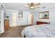 Bright main bedroom with neutral carpeting, plenty of closet space, and light blue walls at 10513 Carrollview Dr, Tampa, FL 33618