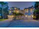 Stunning two-story home with a modern design, manicured landscaping, and an inviting entrance at 108 Peterson Ln, Palm Harbor, FL 34683