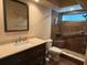 Modern bathroom features sleek vanity, a toilet and a walk-in shower with accessible shower seat at 10811 Candlin Ct, Riverview, FL 33578