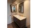 Bathroom featuring a large mirror and classic vanity with storage at 10811 Candlin Ct, Riverview, FL 33578