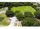 Aerial view of the community includes tennis, basketball courts and a parking lot near the park area at 10811 Candlin Ct, Riverview, FL 33578