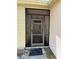 Home's screened-in front door enhances curb appeal and allows for fresh air flow at 10811 Candlin Ct, Riverview, FL 33578