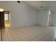 Spacious open living area with tile flooring, high ceilings, and bright, natural light at 10811 Candlin Ct, Riverview, FL 33578