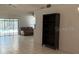 Living area with tile floors, a ceiling fan, and sliding glass doors to the pool at 10811 Candlin Ct, Riverview, FL 33578