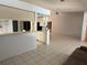 Spacious living room with bar seating offers a perfect spot for entertaining and relaxing at 10811 Candlin Ct, Riverview, FL 33578