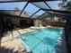 Inviting screened-in pool area with clear blue water and relaxing hot tub, ideal for summer fun at 10811 Candlin Ct, Riverview, FL 33578