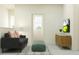 Stylish living room with modern furniture, including a sleek sofa, decorative pillows, and a contemporary rug, creating a welcoming space at 10826 Keato Beach Ct, Tampa, FL 33647