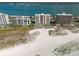 Aerial shot of beachfront condos situated next to a sandy beach along the ocean at 1270 Gulf Blvd # 1901, Clearwater Beach, FL 33767