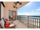 Oceanfront balcony with ceiling fans and comfortable lounge seating offers beach views at 1270 Gulf Blvd # 1901, Clearwater Beach, FL 33767