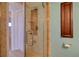 Modern shower featuring glass doors, tiled walls, and recessed shelving at 1270 Gulf Blvd # 1901, Clearwater Beach, FL 33767