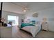 Bedroom features slider doors, wood-style floor, and nautical decor at 1270 Gulf Blvd # 1901, Clearwater Beach, FL 33767