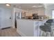 Well-lit kitchen with stainless steel appliances, granite countertops, and breakfast bar with seating at 1270 Gulf Blvd # 1901, Clearwater Beach, FL 33767