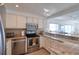 Modern kitchen featuring stainless steel appliances and granite countertops with a seamless design at 1270 Gulf Blvd # 1901, Clearwater Beach, FL 33767