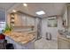 A well-appointed kitchenette in the community area with granite counters and updated appliances at 1270 Gulf Blvd # 1901, Clearwater Beach, FL 33767