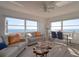 Inviting living room with stylish sofas and breathtaking ocean views through expansive windows at 1270 Gulf Blvd # 1901, Clearwater Beach, FL 33767