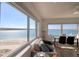 Bright living room with cozy seating and expansive ocean views from large windows at 1270 Gulf Blvd # 1901, Clearwater Beach, FL 33767