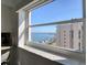 Scenic water view from window provides a picturesque backdrop to coastal living at 1270 Gulf Blvd # 1901, Clearwater Beach, FL 33767