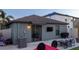 Backyard featuring a patio area with outdoor seating and a mounted television for entertainment at 12720 Hampton Hill Dr, Riverview, FL 33578