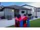 Large backyard with a patio, a playhouse, and a seating area, perfect for Gathering gatherings at 12720 Hampton Hill Dr, Riverview, FL 33578