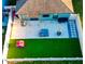 Aerial view of backyard featuring a covered patio and fenced-in green space at 12720 Hampton Hill Dr, Riverview, FL 33578