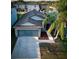 Well-maintained single-Gathering home showcasing a two-car garage, driveway, and mature palm trees at 12720 Hampton Hill Dr, Riverview, FL 33578