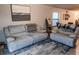 Comfortable living room featuring plush seating, a large window, and a stylish area rug at 12720 Hampton Hill Dr, Riverview, FL 33578
