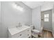 Bright bathroom with white vanity and shower at 1555 Newhope Rd, Spring Hill, FL 34606