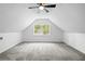 Charming bedroom featuring neutral walls, soft carpet, and a window with outside views at 1562 Oakhurst Dr, Brooksville, FL 34601