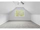Charming bedroom featuring neutral walls, soft carpet, and a window with views at 1562 Oakhurst Dr, Brooksville, FL 34601