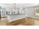 Modern kitchen with stainless steel appliances, white cabinets, and granite countertops at 1562 Oakhurst Dr, Brooksville, FL 34601