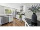 Bright kitchen with stainless steel appliances, granite counters, and ample storage at 1562 Oakhurst Dr, Brooksville, FL 34601