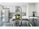 Close-up shot of kitchen sink, granite countertops, and stainless steel appliances at 1562 Oakhurst Dr, Brooksville, FL 34601