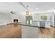 Open-concept kitchen featuring an island, stainless steel appliances, and sleek countertops at 1562 Oakhurst Dr, Brooksville, FL 34601