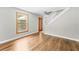 Living room with staircase, front entrance, and window at 1562 Oakhurst Dr, Brooksville, FL 34601