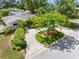 Aerial shot of a home showcasing its landscaping, circular driveway, and overall curb appeal at 1701 38Th N St, St Petersburg, FL 33713