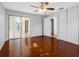 Bedroom with ceiling fan, closet, hardwood floors, and a sunroom at 1701 38Th N St, St Petersburg, FL 33713