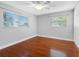 Bedroom featuring hardwood floors, neutral walls, and natural light from large windows at 1701 38Th N St, St Petersburg, FL 33713
