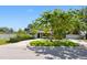 Well-maintained home with mature trees, a lush green lawn, and a spacious driveway at 1701 38Th N St, St Petersburg, FL 33713